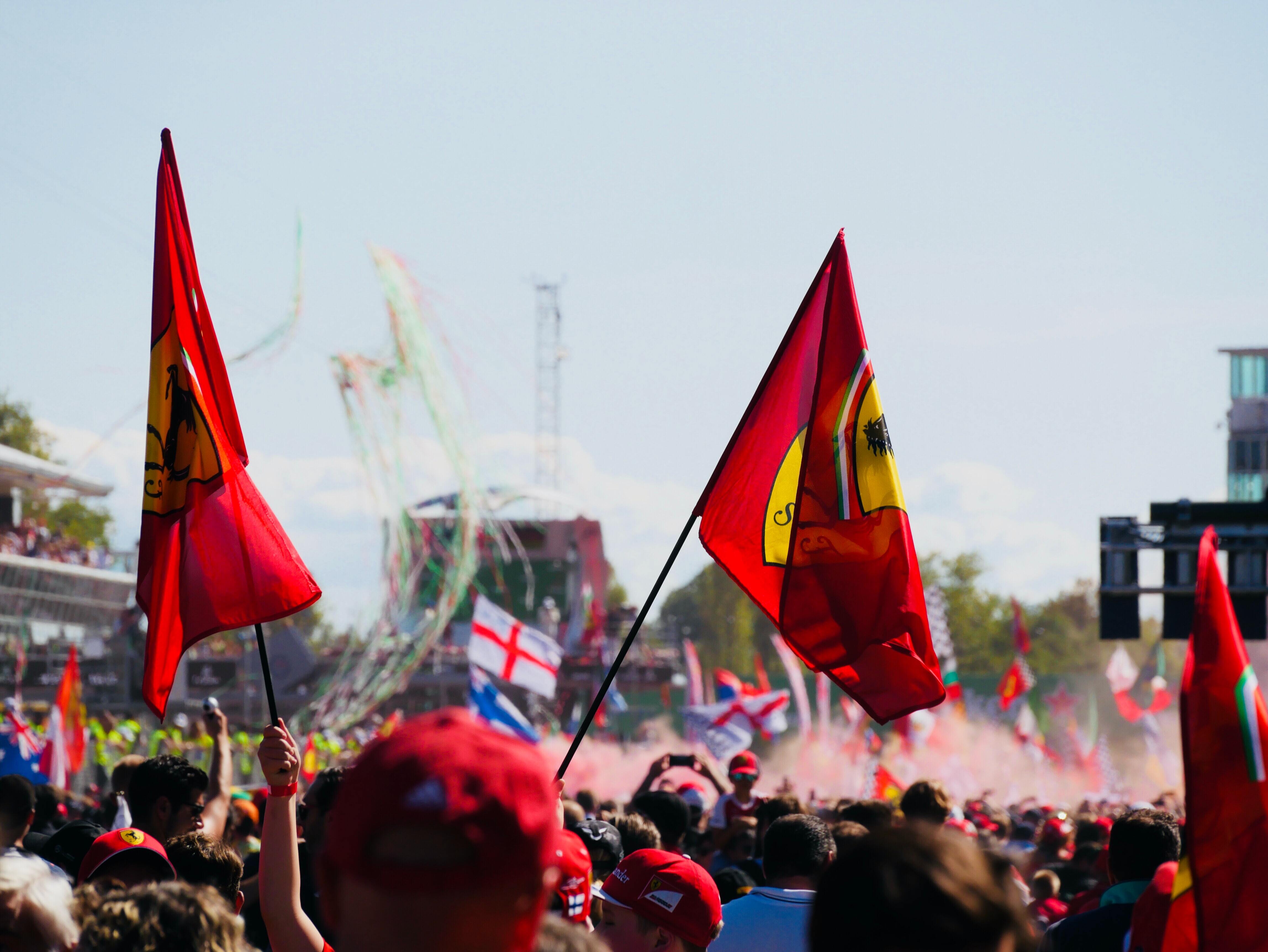 Ferrari fans celebrate during podium ceremony after the race