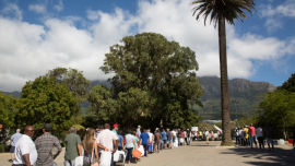 Lines of people wait to collect natural spring water for drinking during the Cape Town drought.