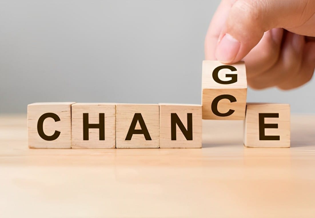 hand flip wooden cube with word change to chance personal development and career growth