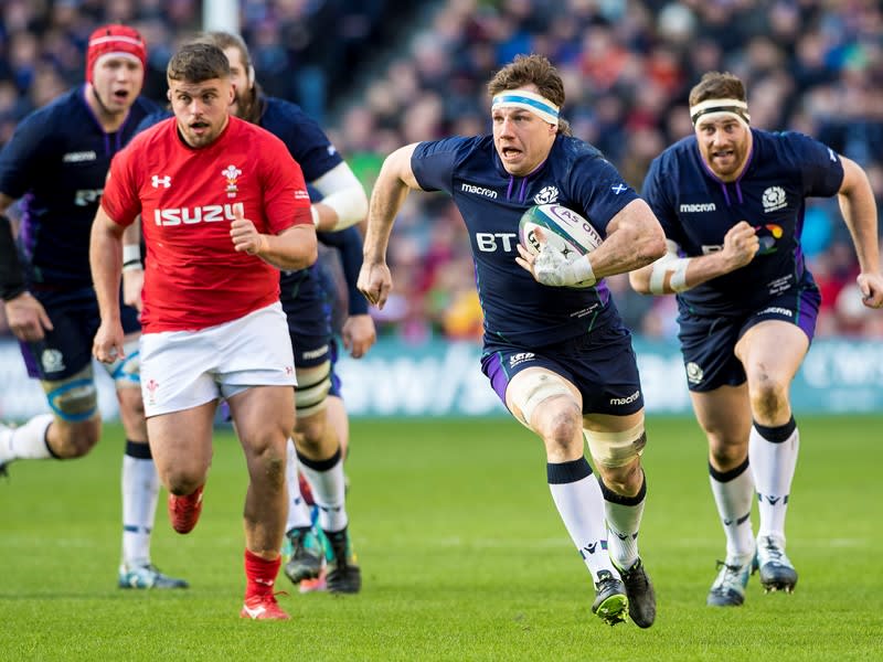 Hamish Watson running with the rugby ball against Wales at BT Murrayfield