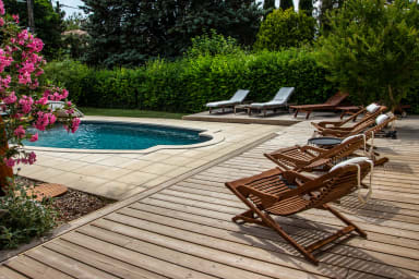 Outdoor swimming pool with wooden deck 