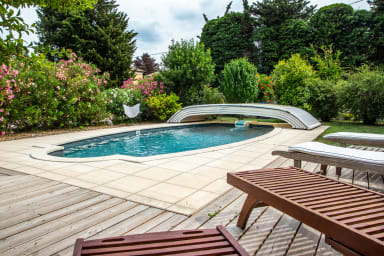 Outdoor swimming pool with wooden deck