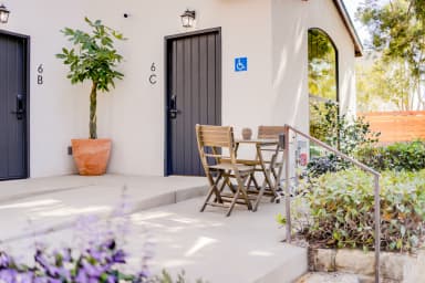 a patio with bistro set complete