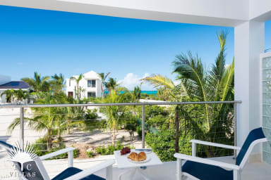 Little Plum's private balcony with partial views of Grace Bay Beach. 