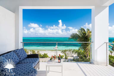Villa Sandcastle's elevated lounging area with views of Grace Bay Beach. 