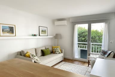 Air-conditioned living room, large sofa bed, dining table, TV, bar