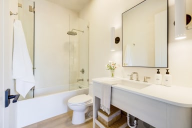 En-suite bathroom with rain shower and high-end toiletries