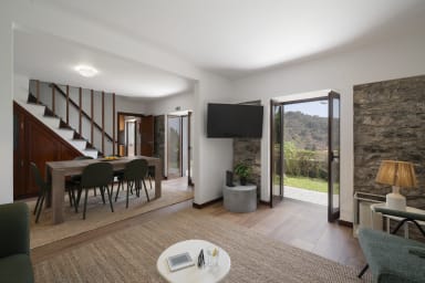 Livingroom with a TV , dinning room and stairs