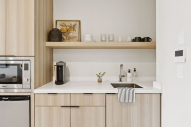 Kitchenette: Nespresso, mini-fridge, microwave/air-fryer. No stove.