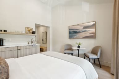 King-size bed, seating area, and Kitchenette with Nespresso and Mini Fridge