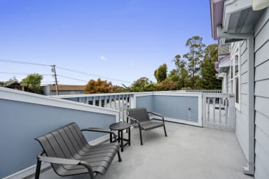 Private balcony with two chairs and serene views