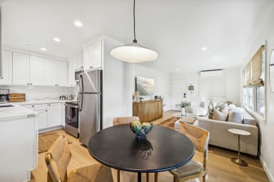 Bright dining area with seating for four.