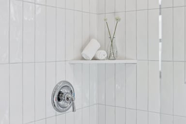 En-suite bathroom with shower and high-end toiletries