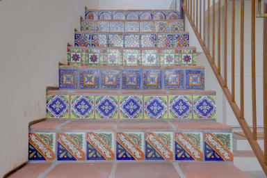 A staircase that smiles, where your colorful Santa Barbara adventure begins.