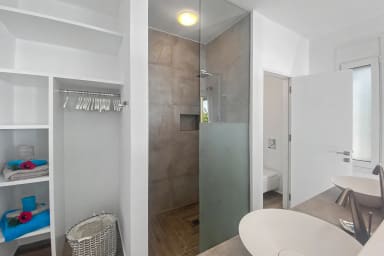 Crisp, modern bathroom designed for comfort and effortless self-care.