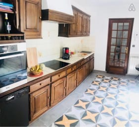 Fully-equipped kitchen with an electric stove