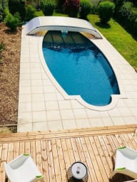Outdoor swimming pool with wooden deck 