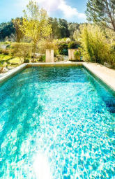 Outdoor swimming pool with wooden deck