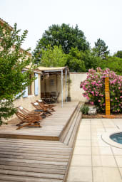 Outdoor swimming pool with wooden deck 