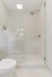 A private bath with a rain shower
