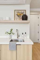 Nespresso, mini-fridge, microwave/air-fryer, plates/utensils. No stove.