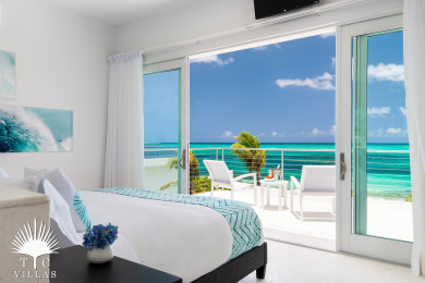 Master suite with balcony and beach views.