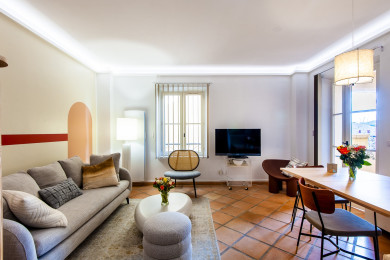 Comfortable living room with convertible sofa, TV