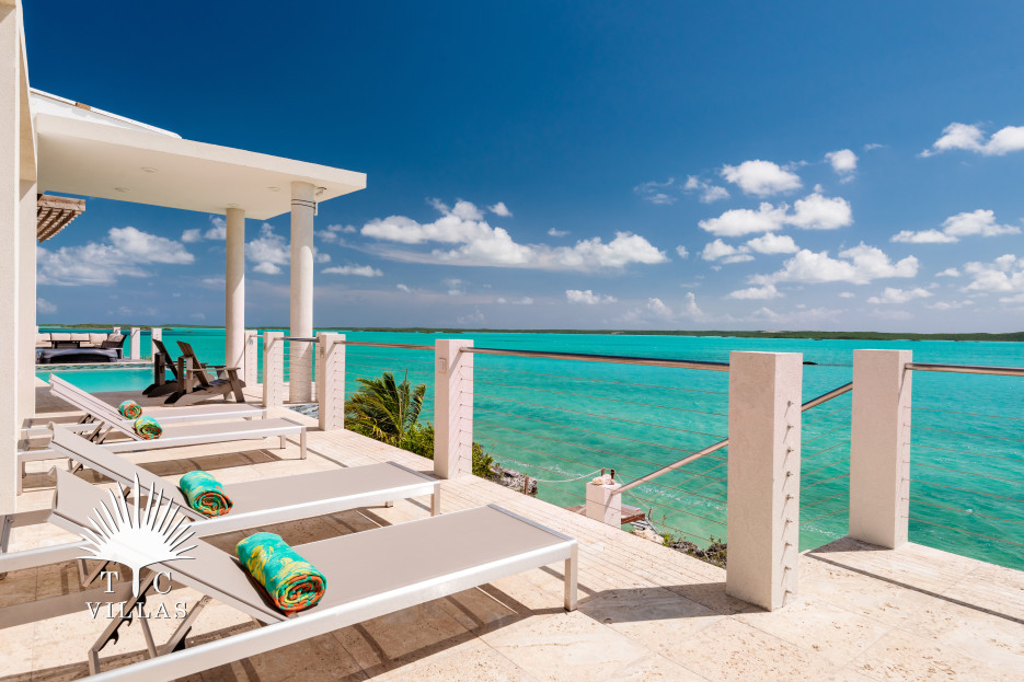 Lounging outdoor deck with views to Chalk Sound.