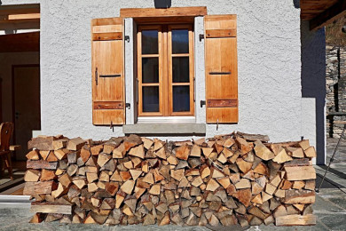 Pile of wood in front of the chalet