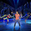 Aaron Sidwell as Michael Dork with Comany