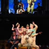 Adebayo Bolaji as Blues Man, Ncuti Gatwa as Adolphus, Nandi Bhebhe as Harry, and Company in Emma Rice's 946: The Amazing Story of Adolphus Tips