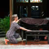 Evasive action: Emma (Saskia Portway) resists the attentions of Tartuffe (Mark Meadows) while husband Charles (Christopher Bianchi) hides under the piano