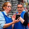 Actors Tracy Gabbitas and Jennifer Banks as supermarket shelf stackers Tracey and Donna in Strife In A Northern Town