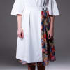 Ruffled white dress with cut-out sleeves and a removable kilt skirt