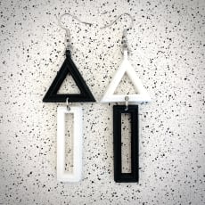 White / Black Mismatch Triangle Earrings: Quirky mismatch design. Choose any two colours to create your perfect pair!
