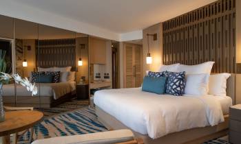 a bedroom with a large bed in a hotel room