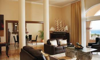 a living room filled with furniture and a large window