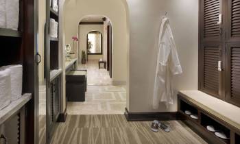a room with a sink and a mirror