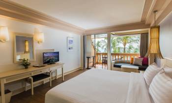 a bedroom with a large bed in a room