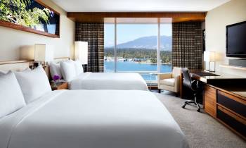 a bedroom with a large bed in a hotel room