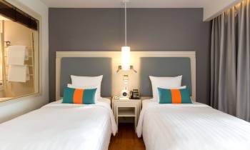 a bedroom with a bed in a hotel room