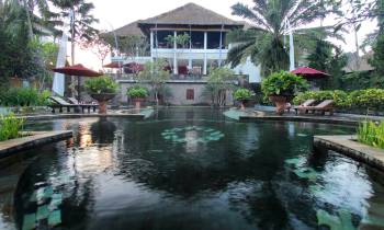 a small house surrounded by water