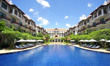 a house with a large pool of water
