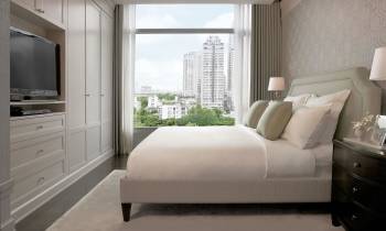 a bedroom with a large bed in a hotel room