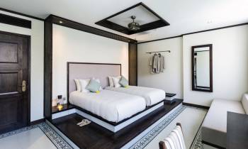 a bedroom with a bed and a mirror