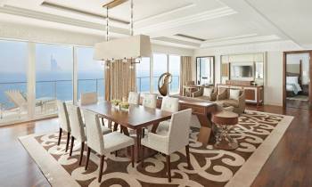 a dining room table in front of a window