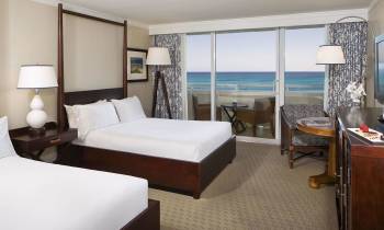a bedroom with a large bed in a hotel room