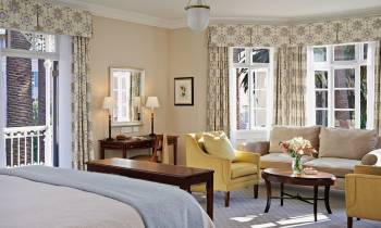 a living room filled with furniture and a large window