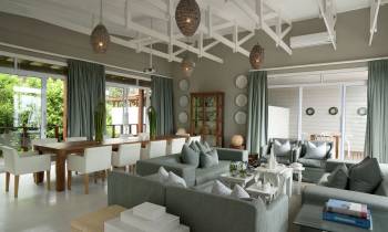 a living room filled with furniture and a large window