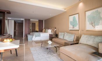 a living room filled with furniture and a large window